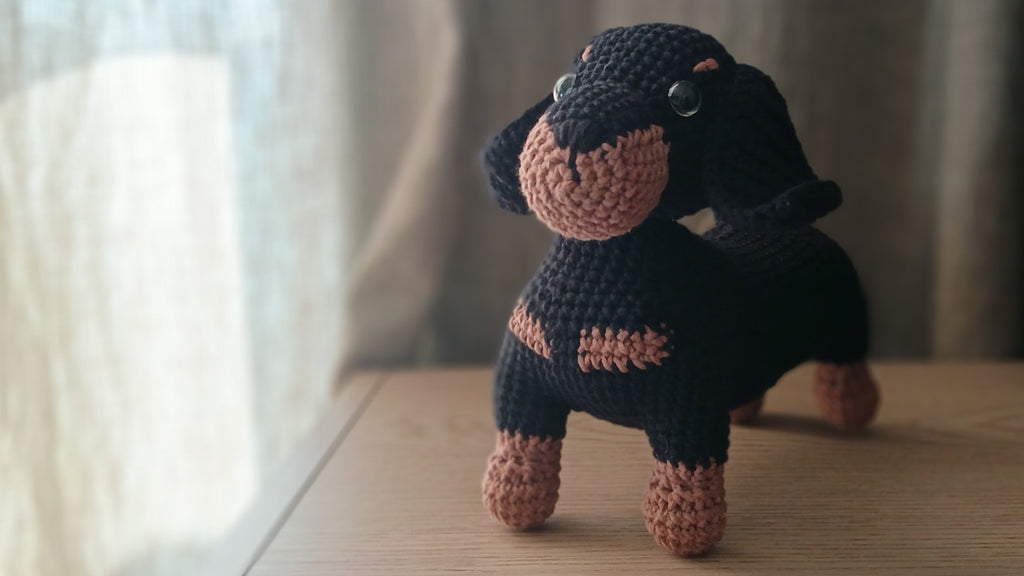 Crochet dachshund plushie, view from the front