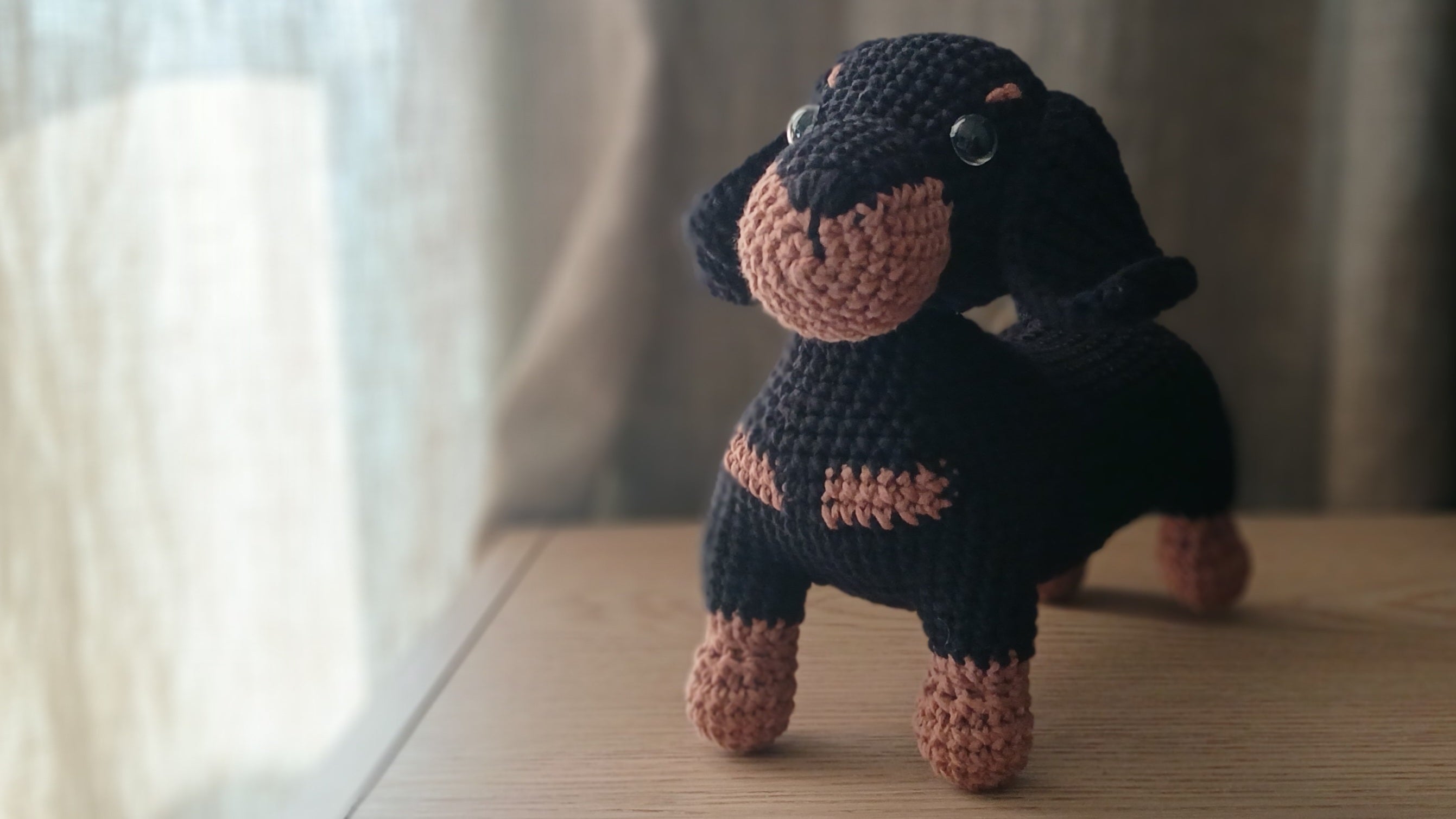 Crochet dachshund plushie, view from the front