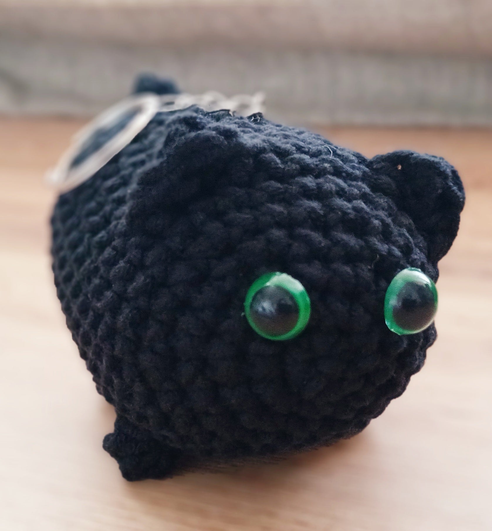 Chunky black cat keychain with green eyes