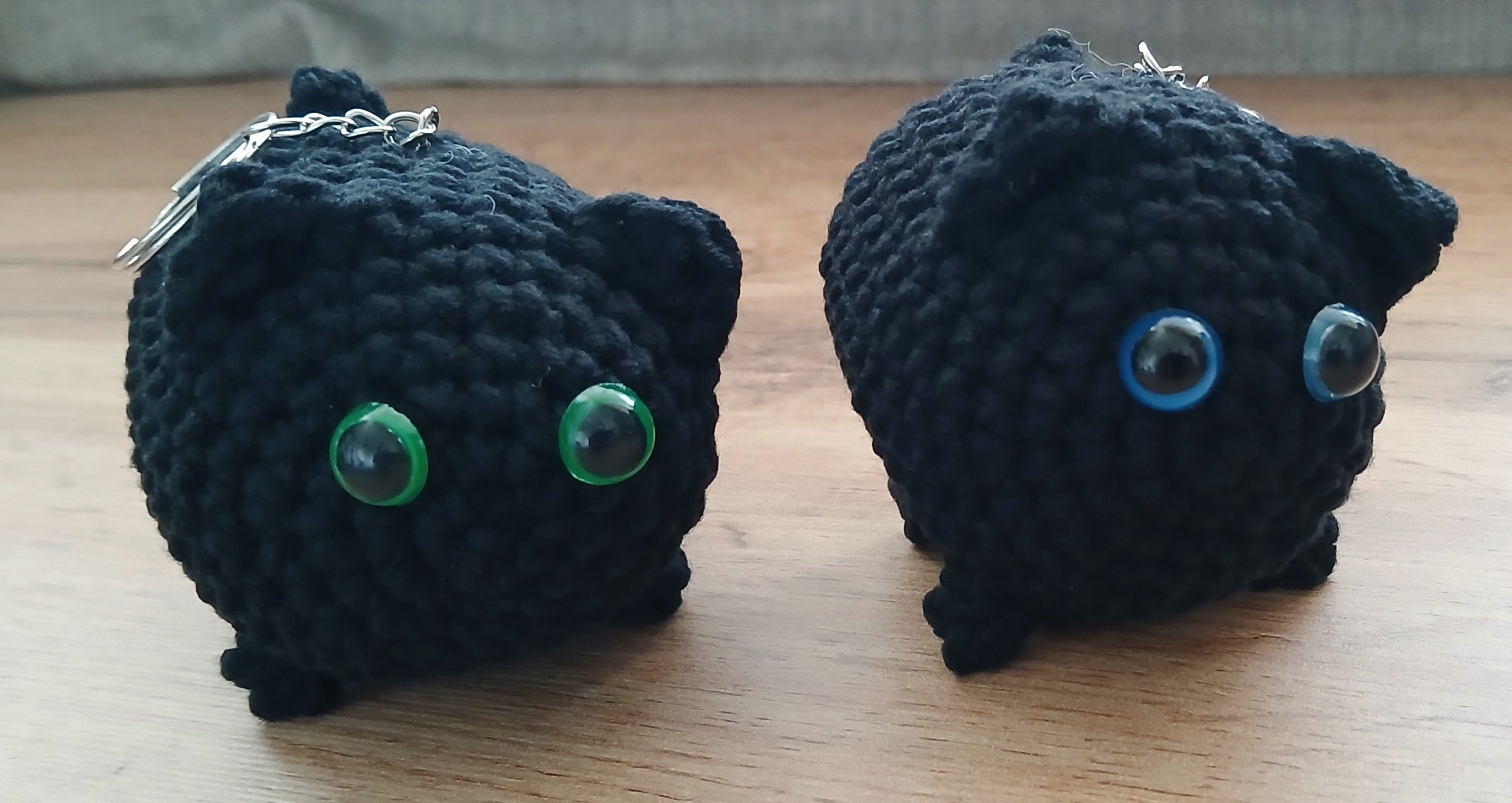 Two black cats keychains 