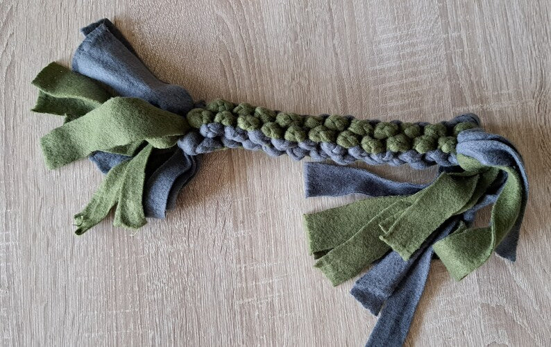 Fleece dog tug toy in blue and green