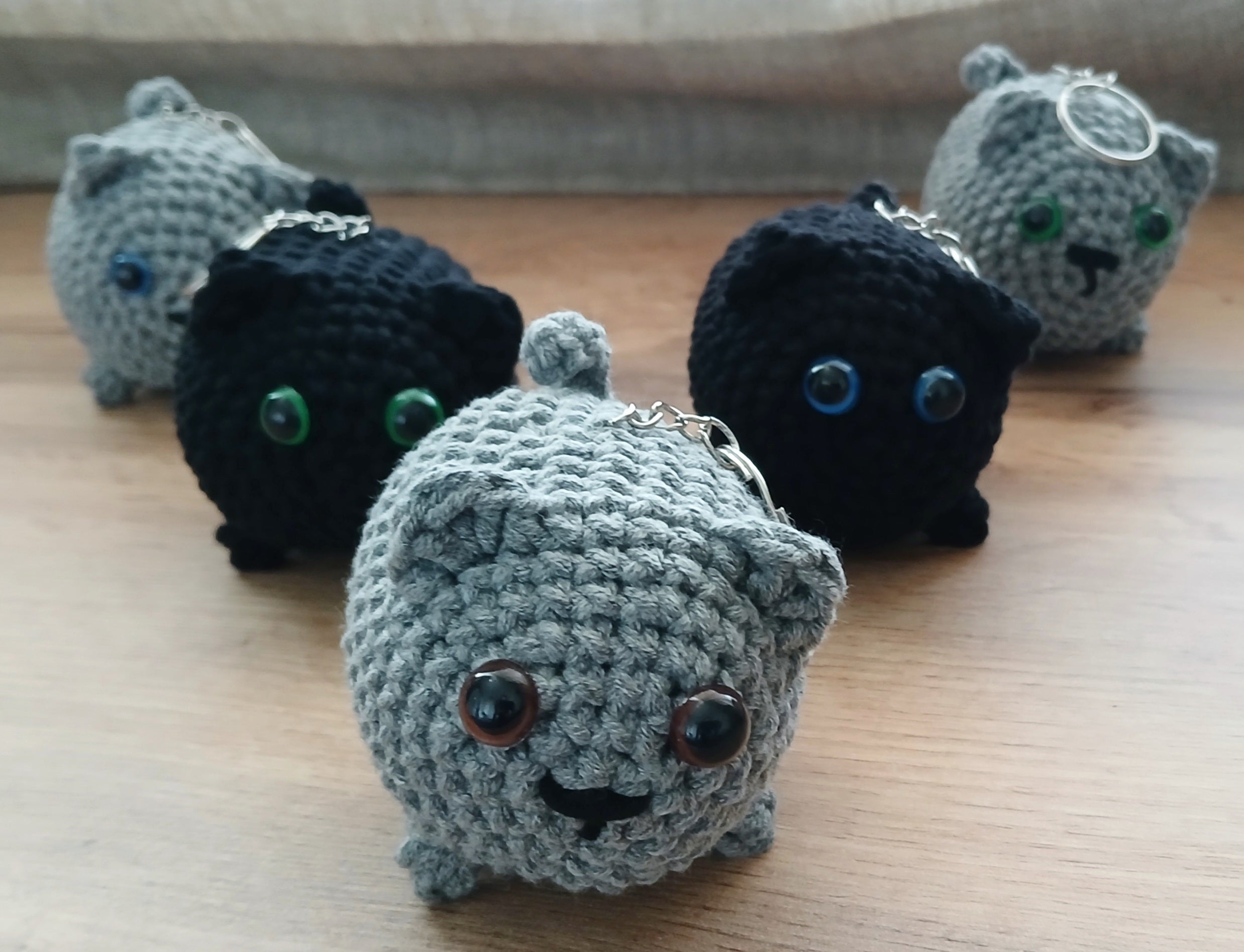 A bunch of crochet cats keychains for cat lovers