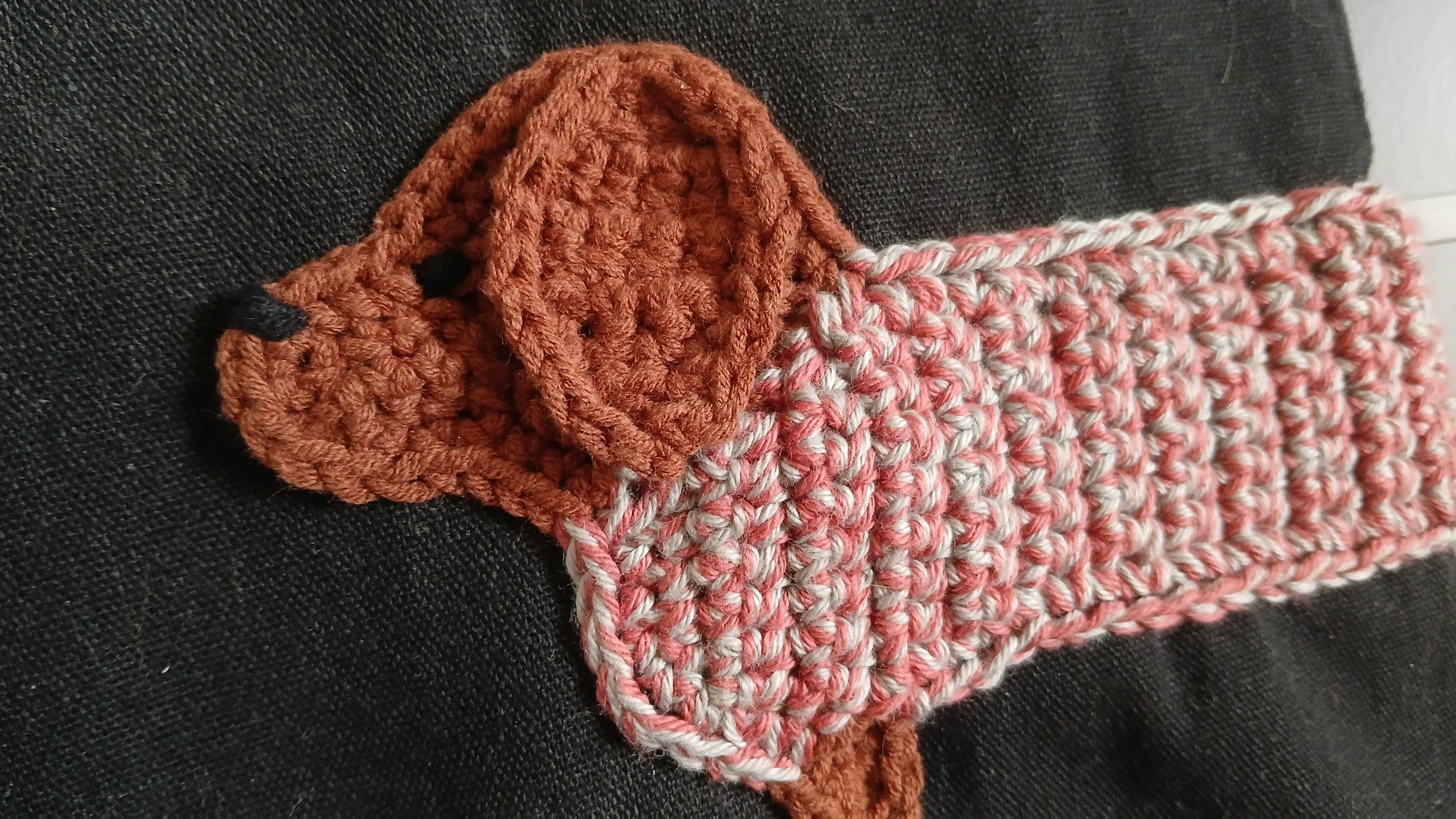 Close up on face of dachshund applique 