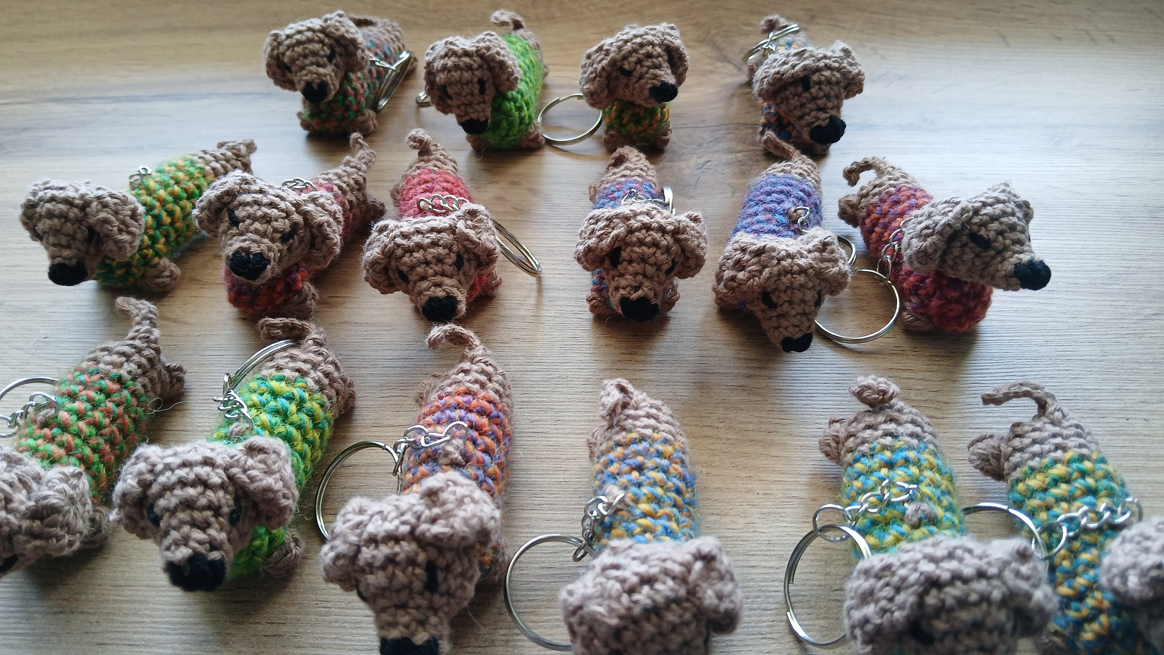 Dachshunds with colorful sweaters in a form of keychains 