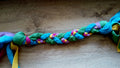 Fleece tug toy in multiple colors, mainly green and blue