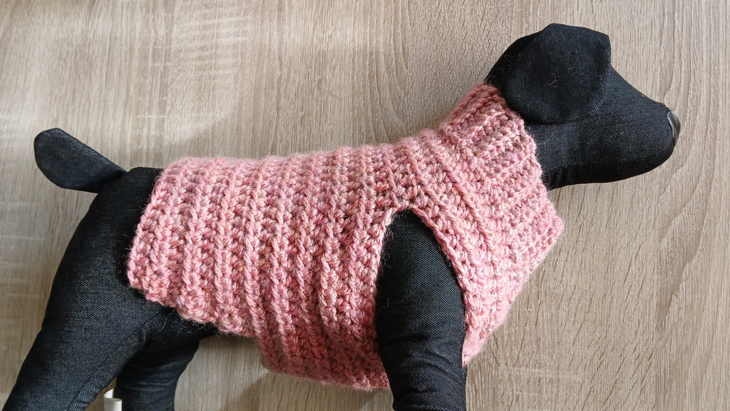 A dog sweater on a mannequin, showing the side