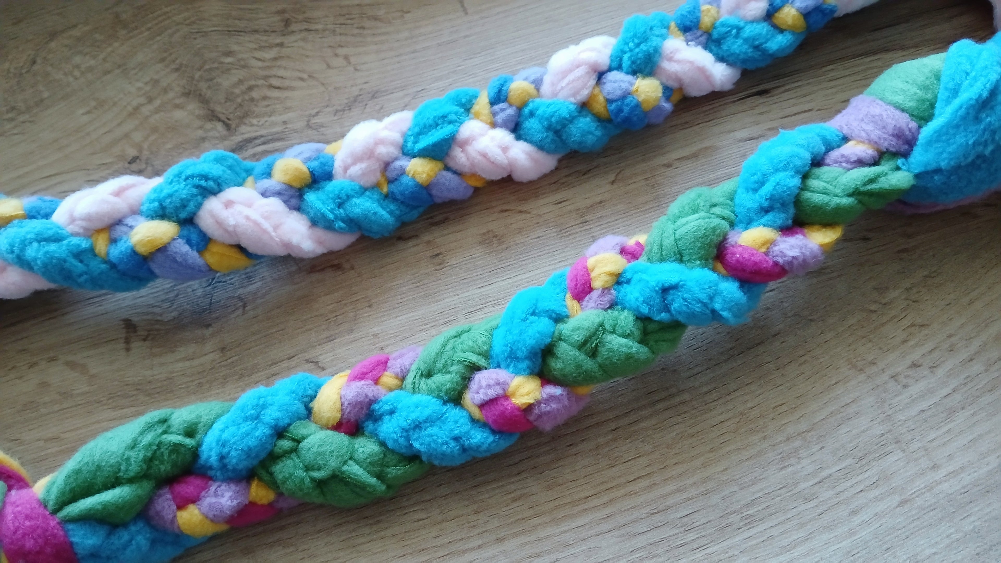 Close up on colorful fleece dog tug toy 