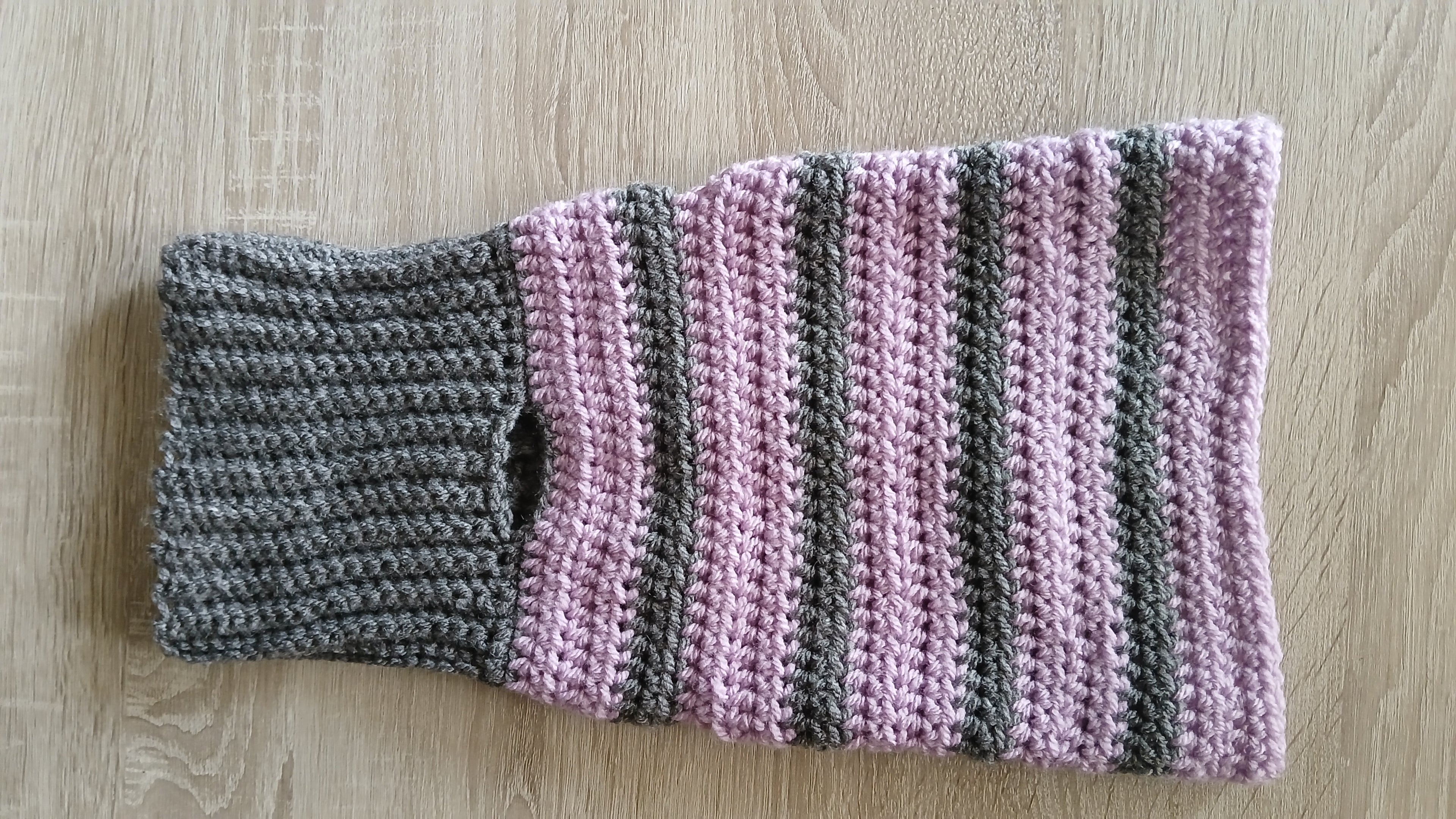 A flatlay of striped grey lilac dog turtleneck 