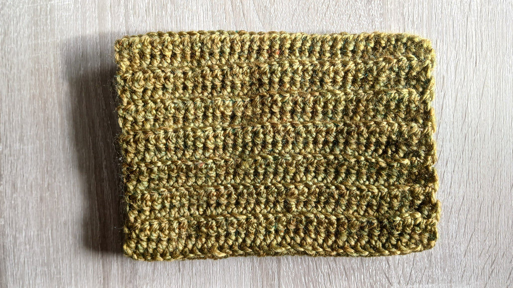 Flatlay of khaki green dog scarf