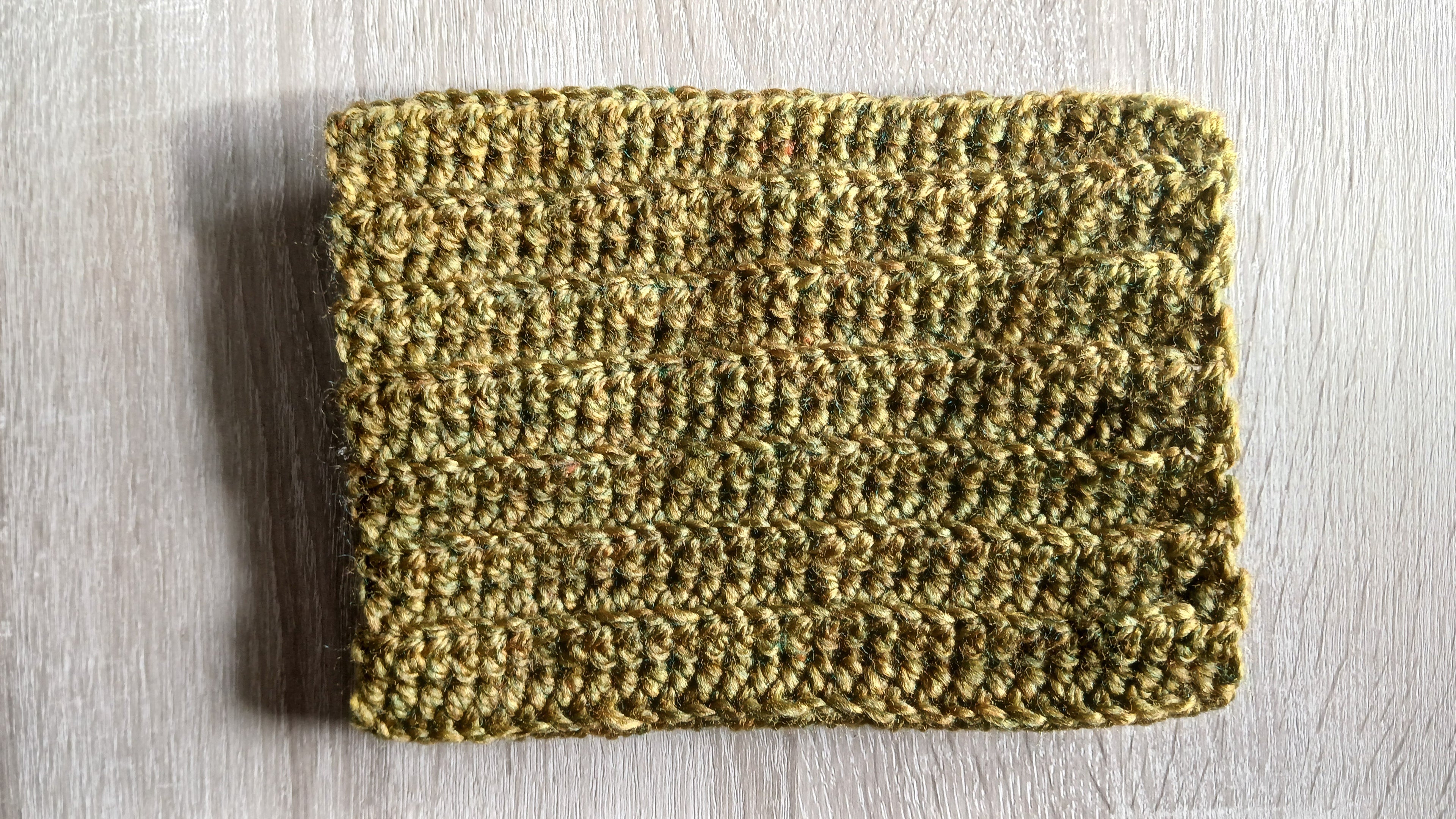 Flatlay of khaki green dog scarf