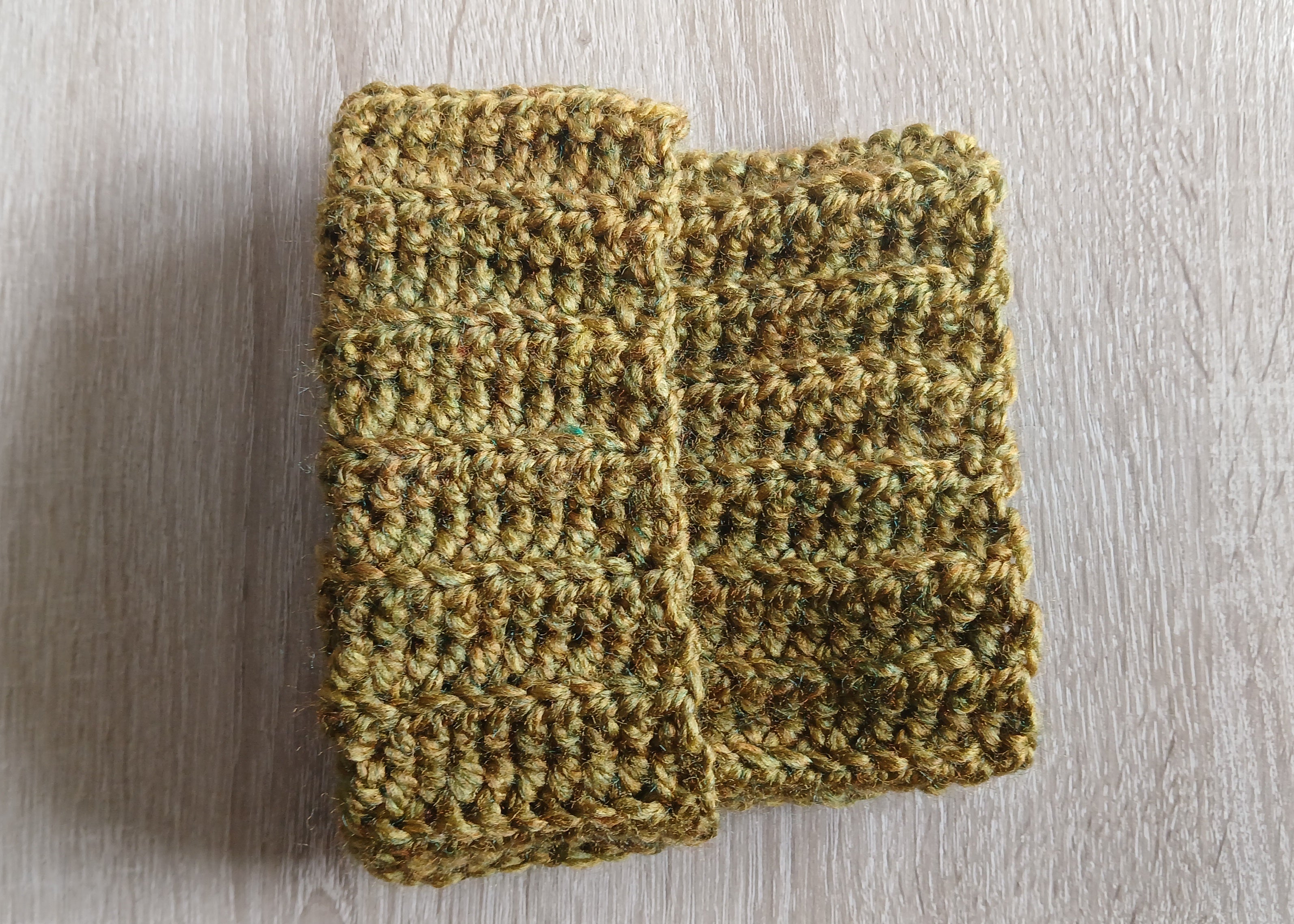 Khaki green dog snood rolled up