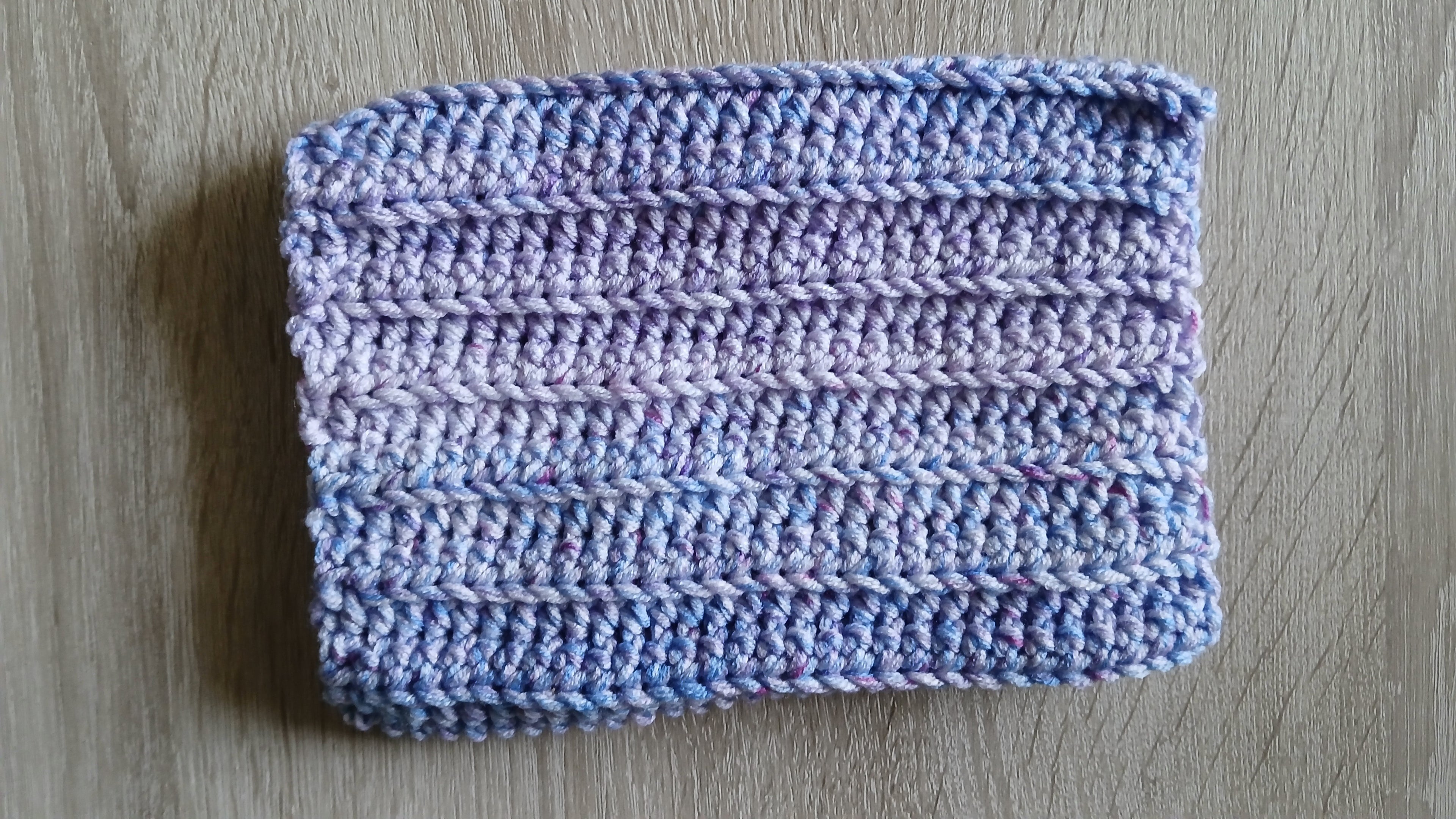 Flatlay of lavender ombre crochet dog snood 