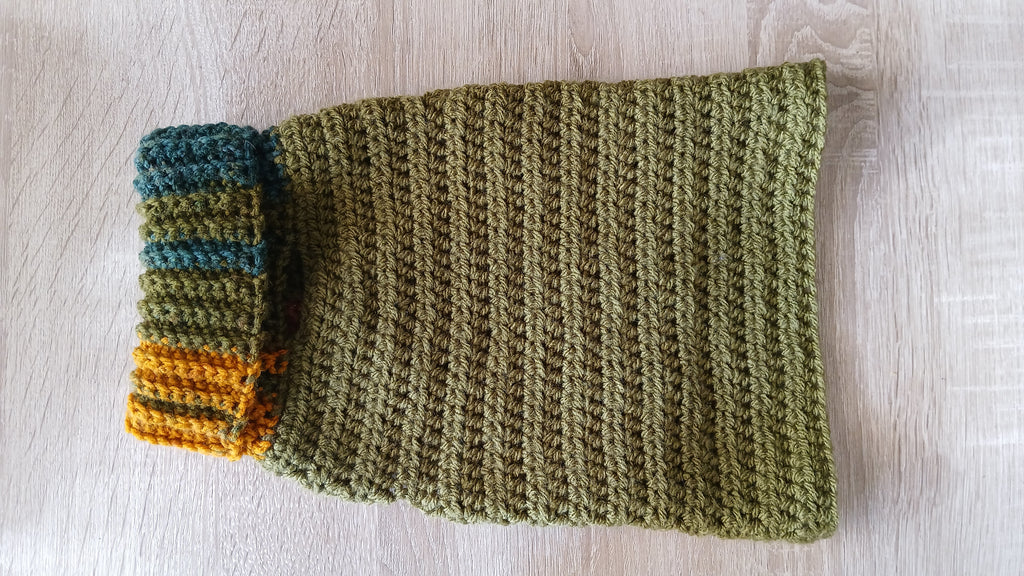 A dog sweater with rolled up turtleneck 