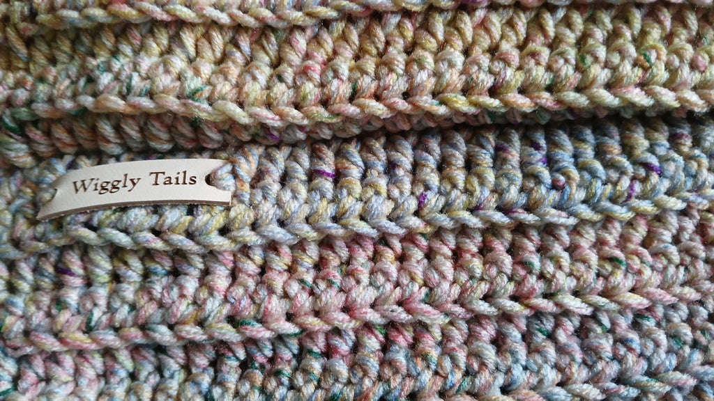 A close up of the snood, showing label "Wiggly tails"