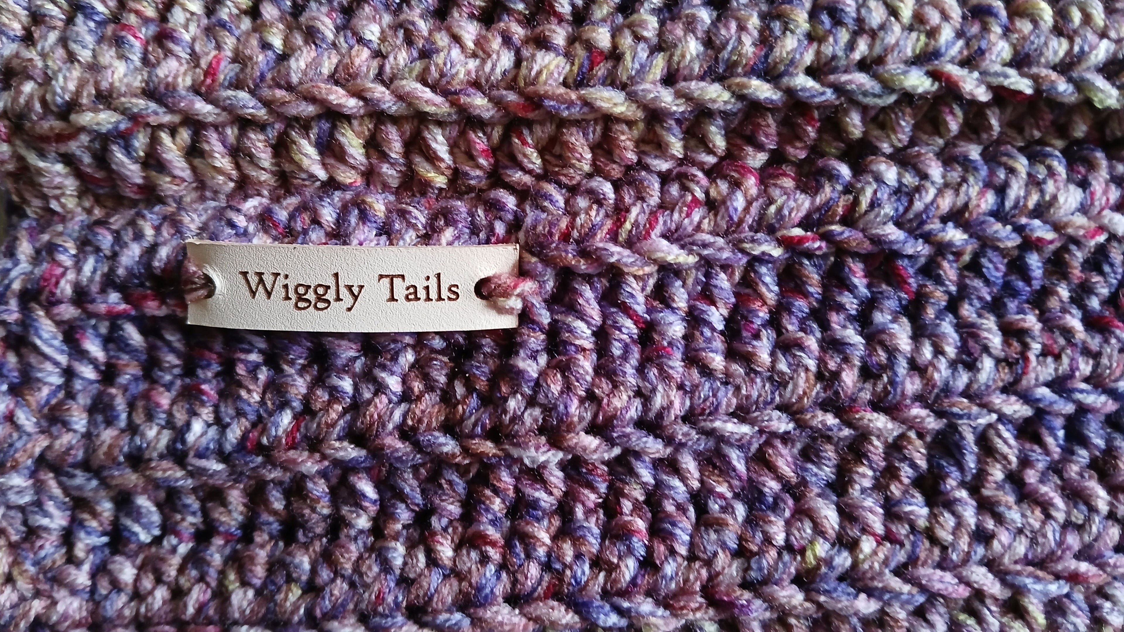 Close up on a colorway and stitching of a handmade dog snood