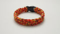 Colorful orange paracord dog collar with a black clasp