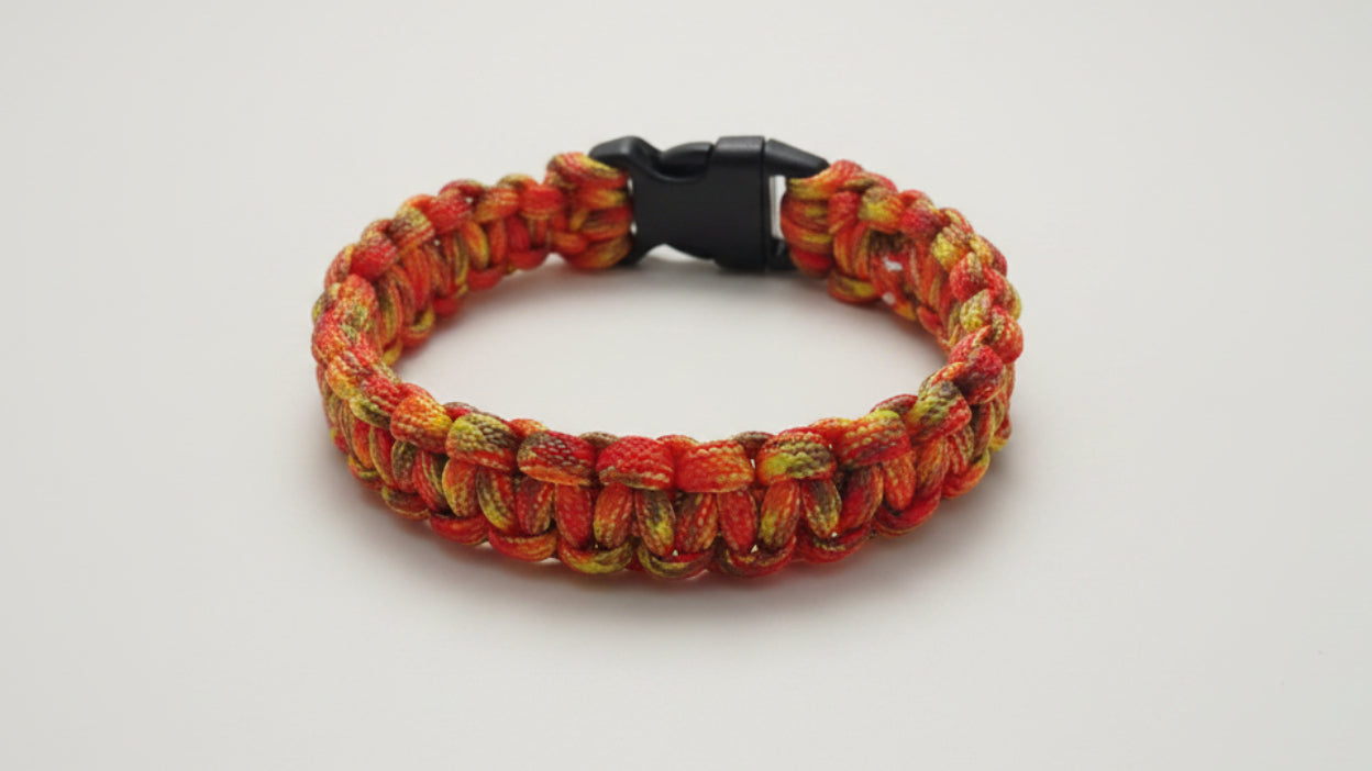 Colorful orange paracord dog collar with a black clasp