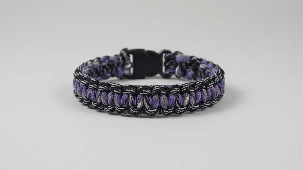 Dog collar with purple and black pattern and white accents