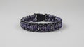 Dog collar with purple and black pattern and white accents