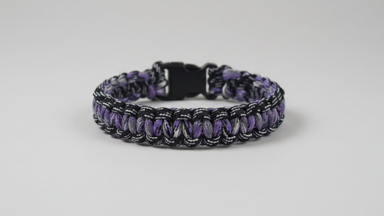 Dog collar with purple and black pattern and white accents